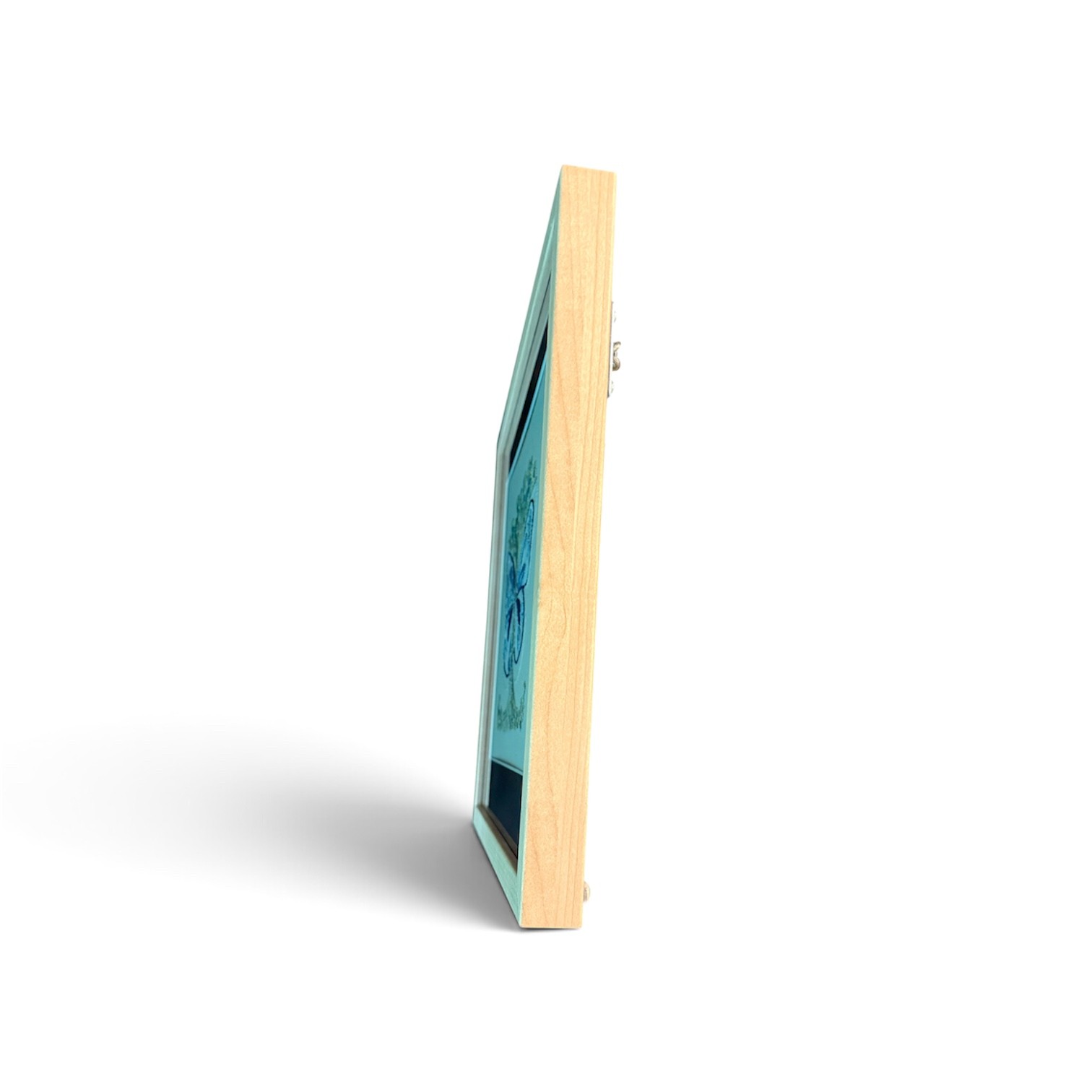 Side view of the light wood frame showing depth and construction.